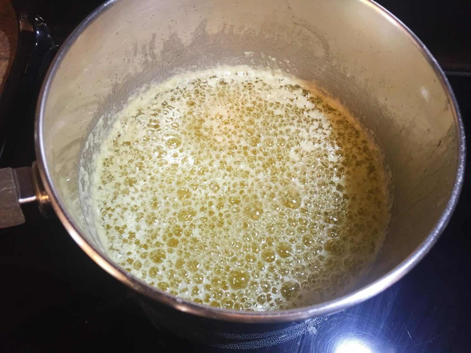 Melted butter that has foamy bubbles on top.