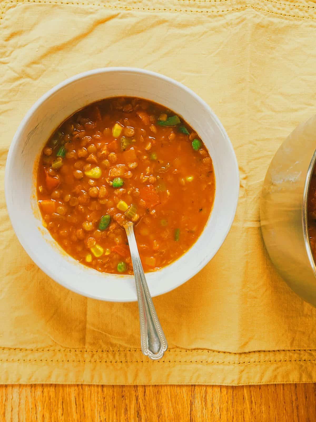 Soup in a bowl with a spoon.