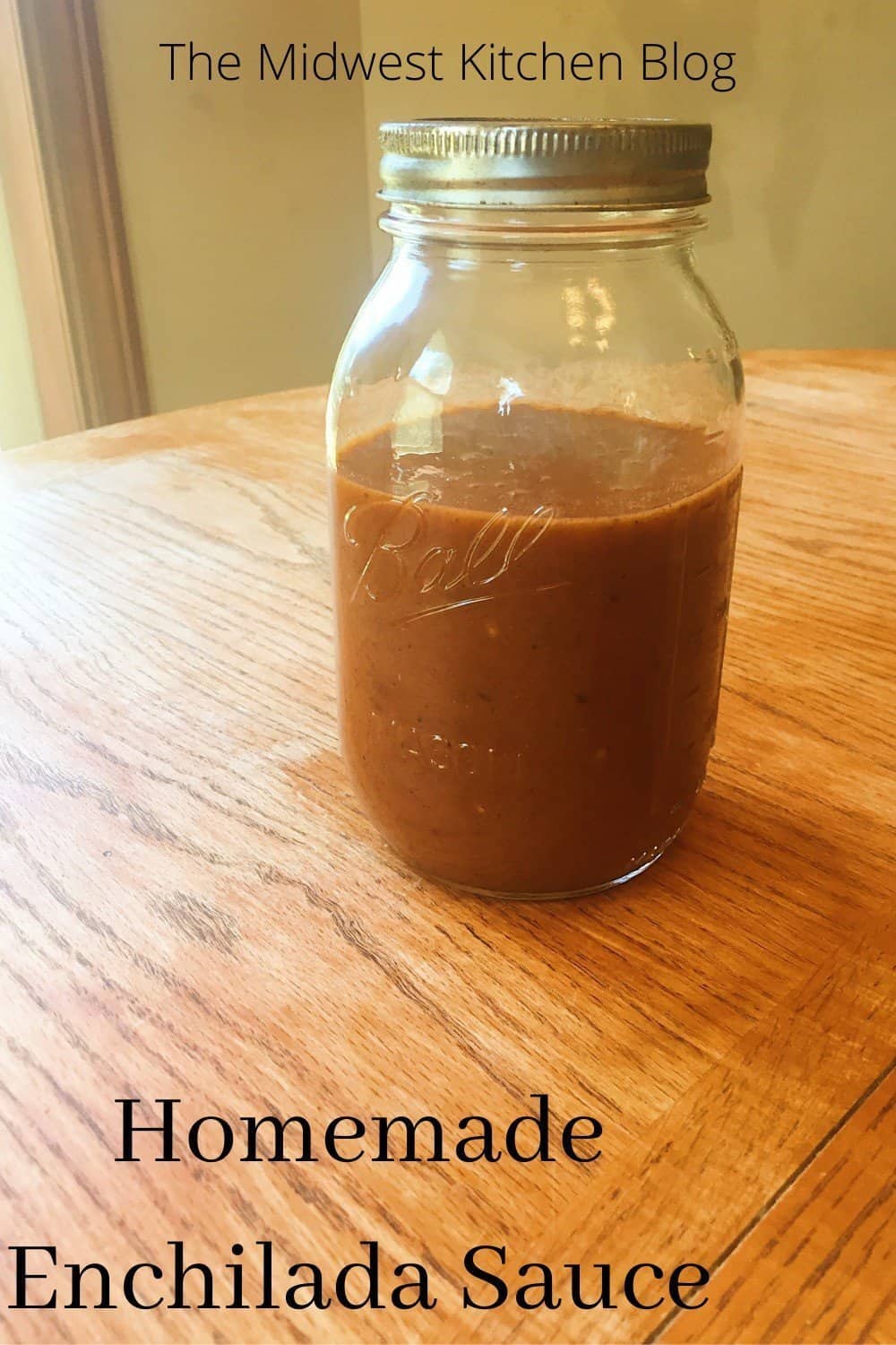 Enchilada sauce in a jar mason on a table.