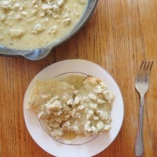 Overhead image of chicken sausage and gravy over biscuits.