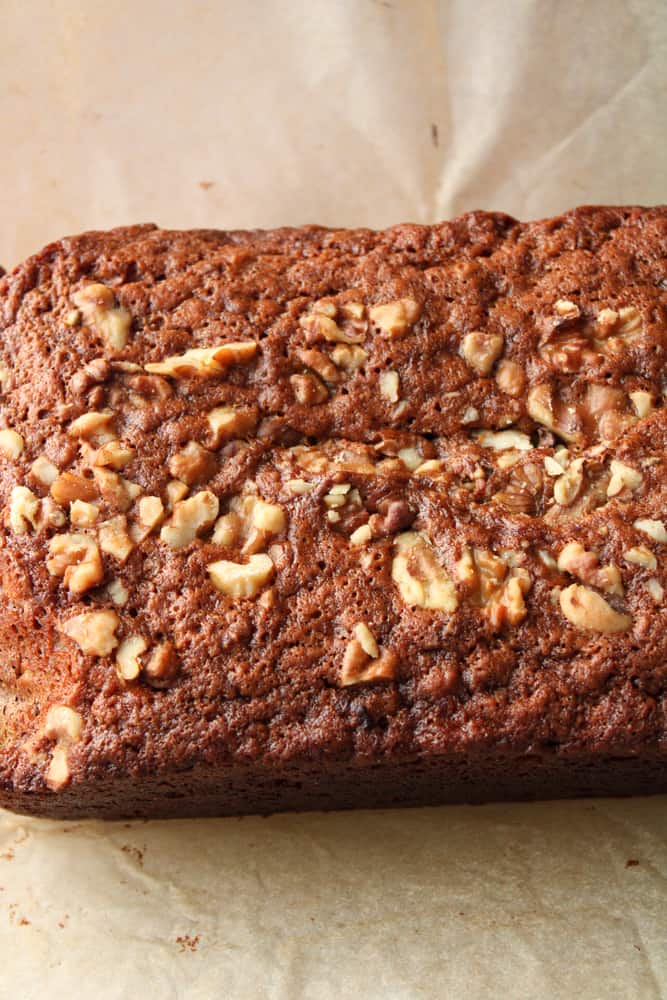 Baked banana bread on a parchment paper.