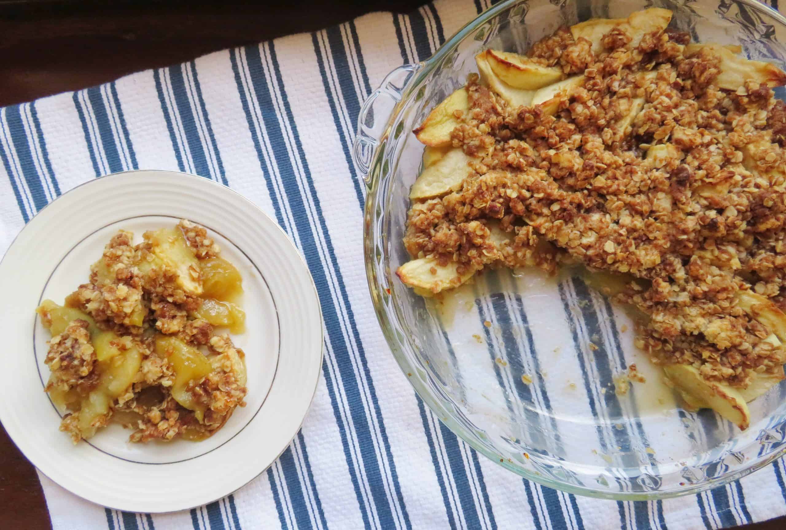 Apple crisp in a pan and on a plate.