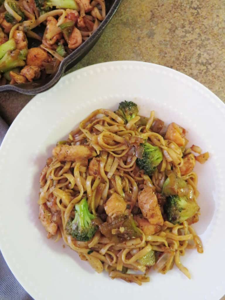 Chicken broccoli noodles stir fry in a bowl.