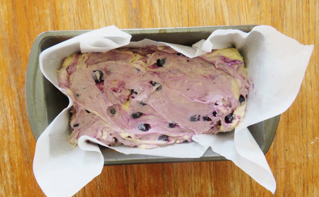 Pound cake batter in a loaf pan on the table.