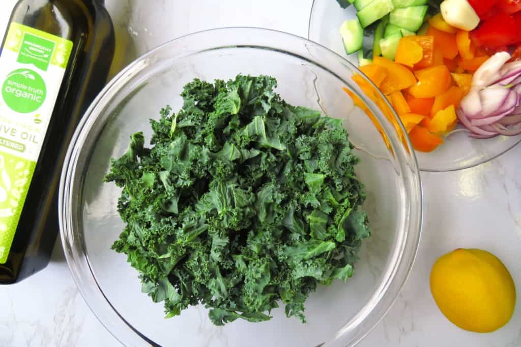 Kale salad ingredients on a table.