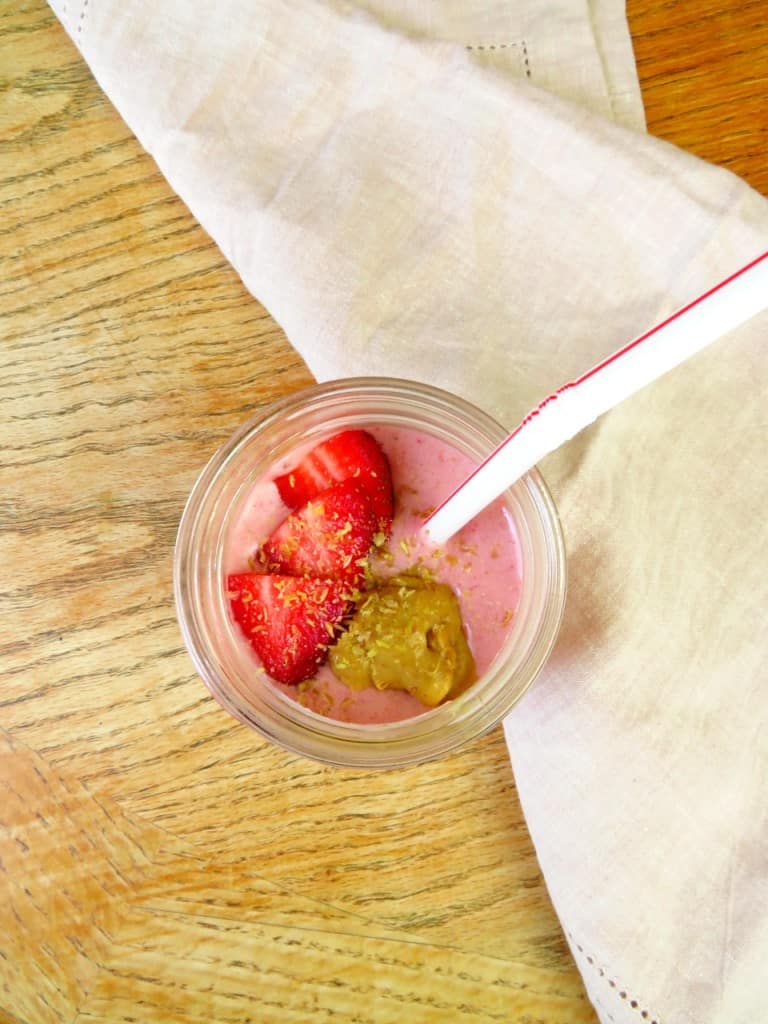 Close up on a strawberry peanut butter banana smoothie