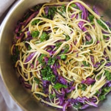 Close up on kale cabbage pasta in a skillet.