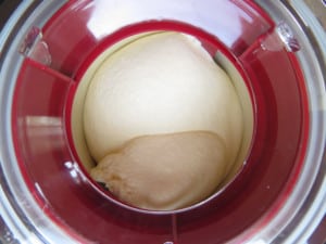 Overhead image of ice cream churning in an ice cream machine.
