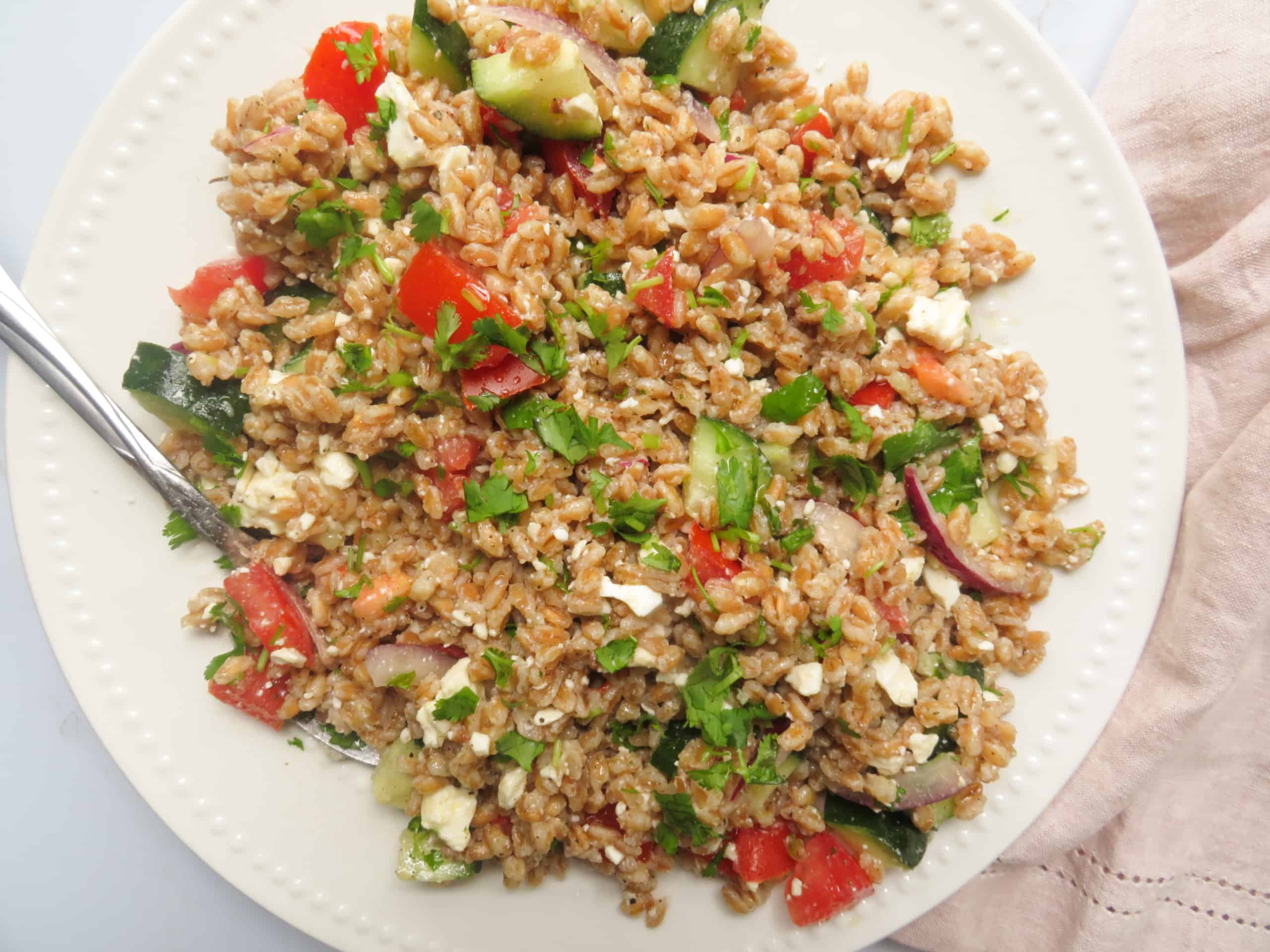 Wheat berry salad on a plate.