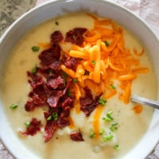 top view of potato soup in a bowl on a table