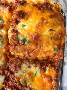 Close up on a slice of beef lasagna.