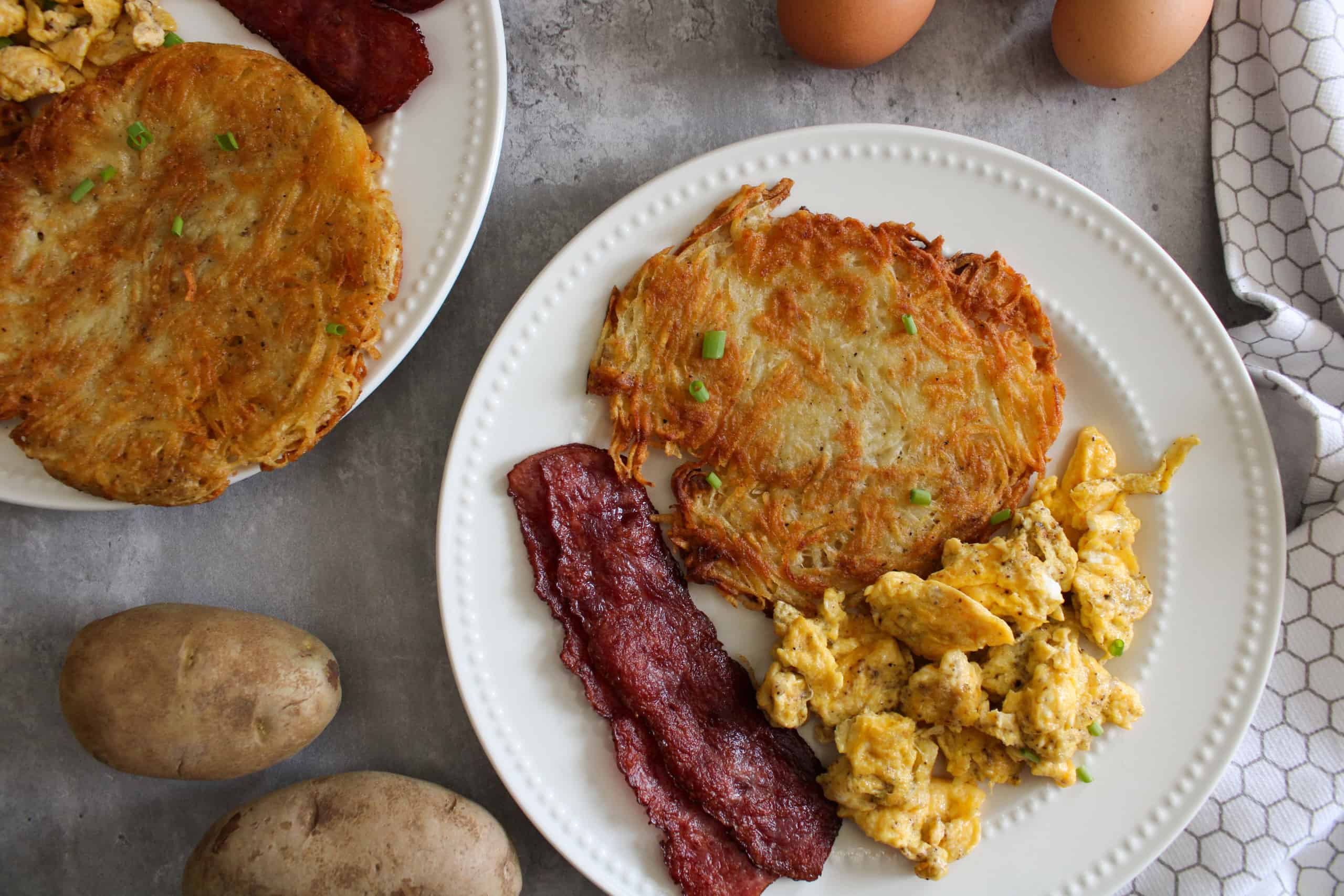 https://www.themidwestkitchenblog.com/wp-content/uploads/2021/12/cheesy-hash-browns-scaled.jpg