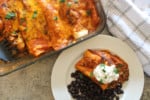top view of easy enchilada recipe on a table with black beans