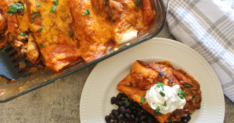 top view of easy enchilada recipe on a table with black beans