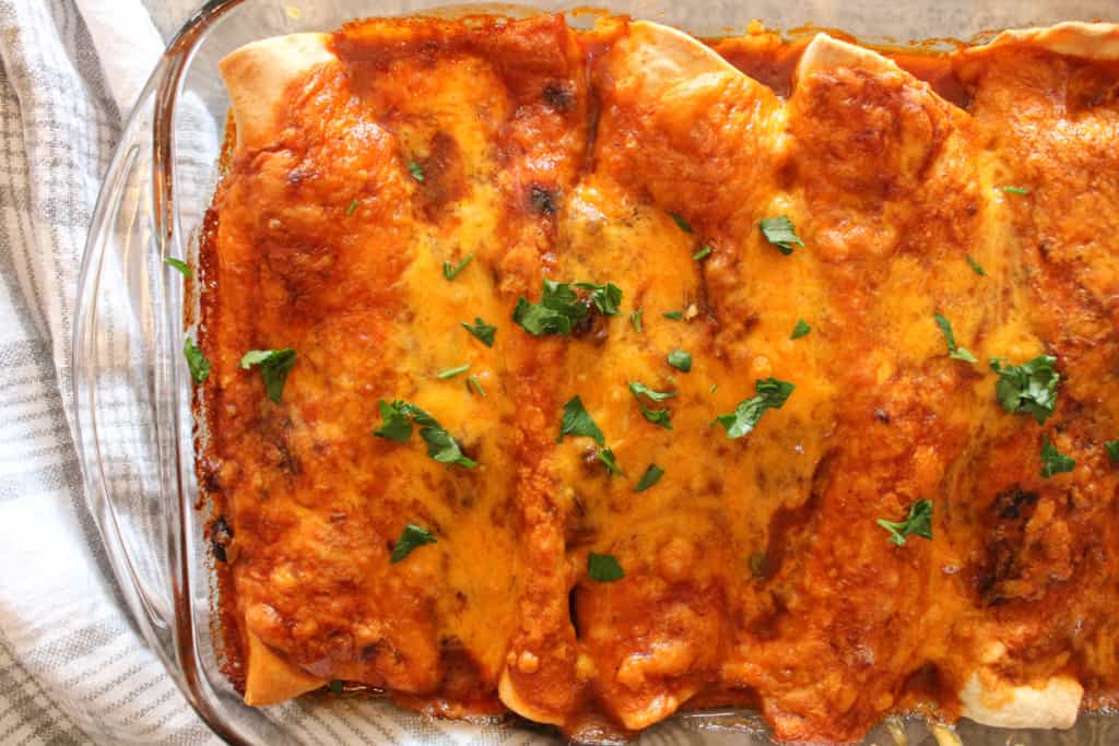 top view of healthy enchiladas with red sauce