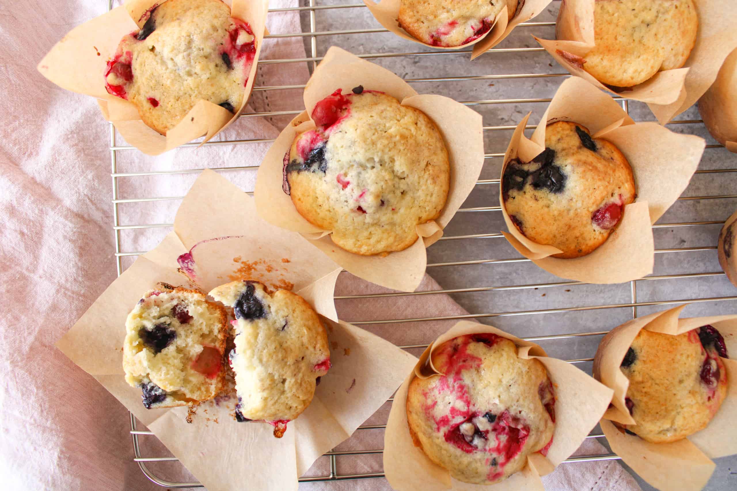Close up on very berry muffins on a wire rack