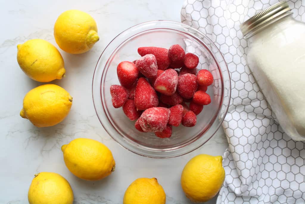 top view of strawberry lemonade ingredients on a table