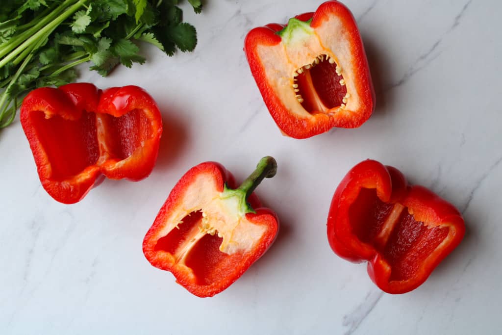 Sliced red bell peppers on a table.