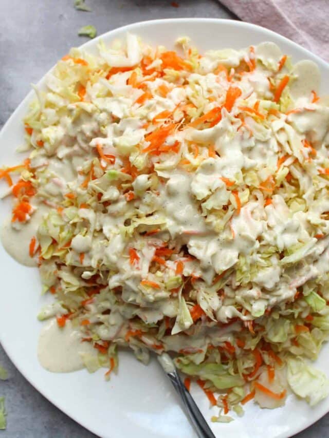Easy coleslaw with dressing on a plate.