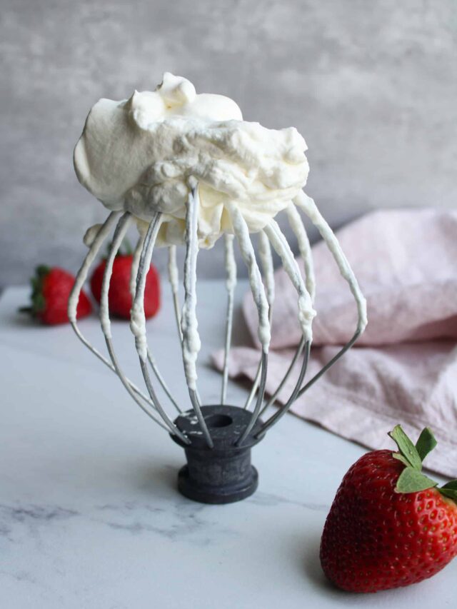 Whisk with whipped cream on top.