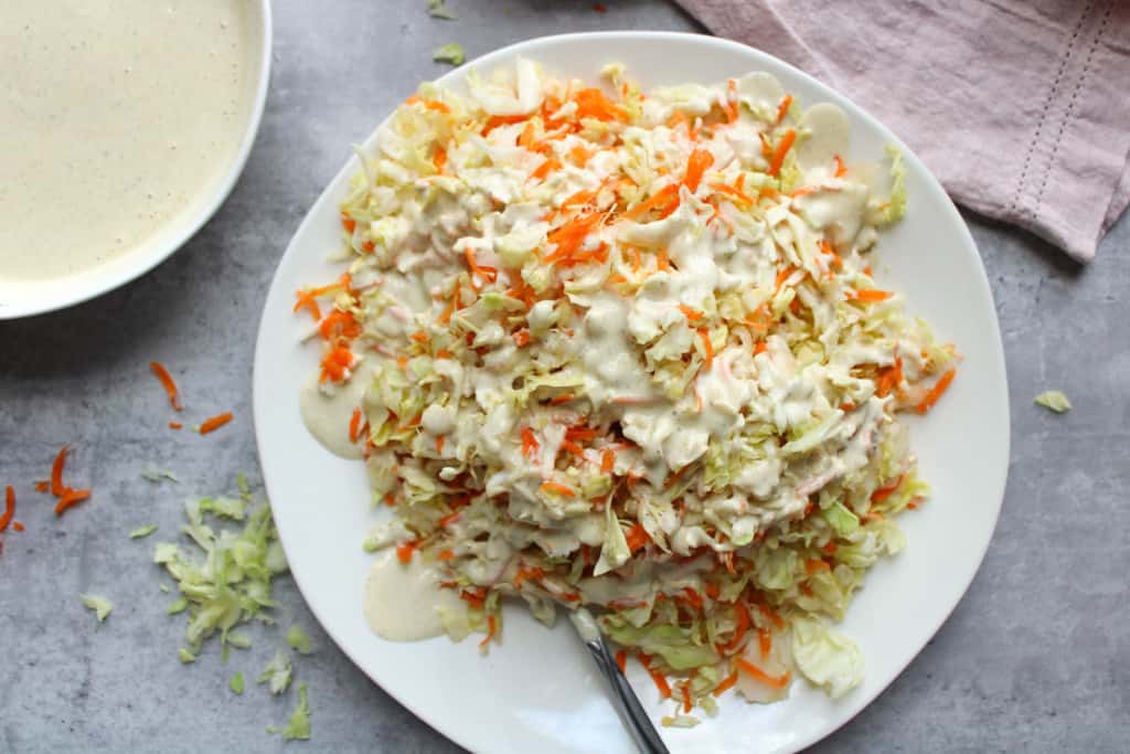 Easy coleslaw with dressing on a plate. 