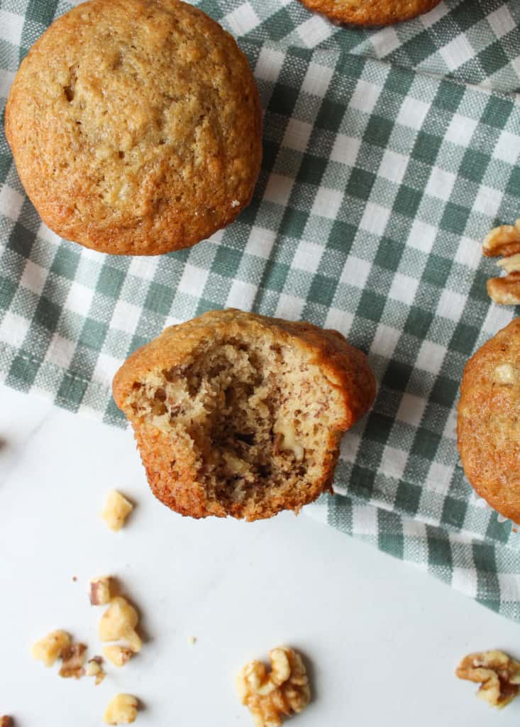 Close up on a banana muffin with a bite taken out of it. 