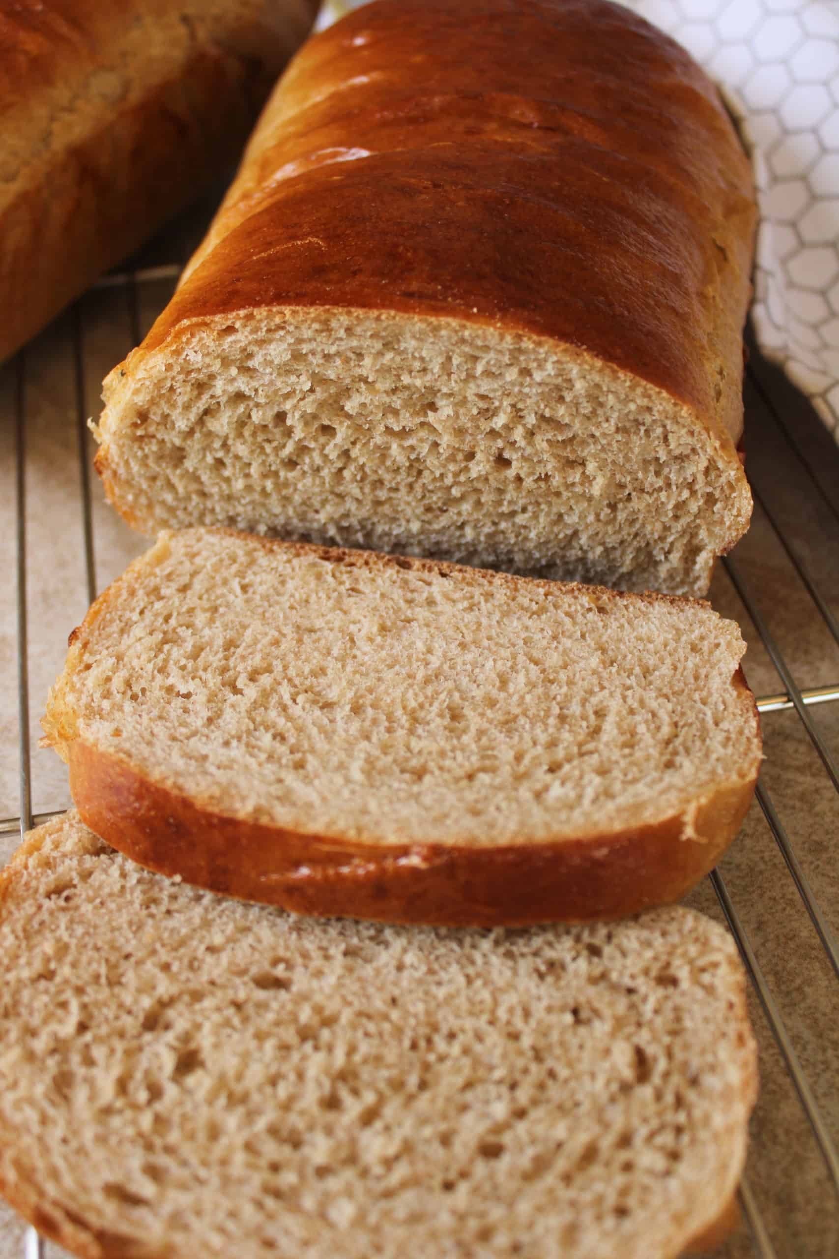 Close up on a sliced loaf of bread.