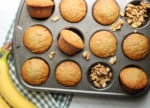 Homemade banana nut muffins in a muffin pan.