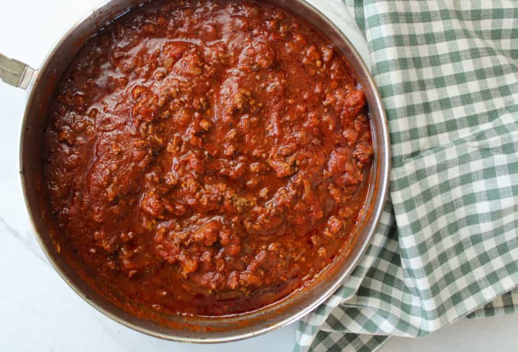 bison bolognese in a skillet on a table. 