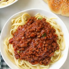 Close up on bison bolognese over pasta.