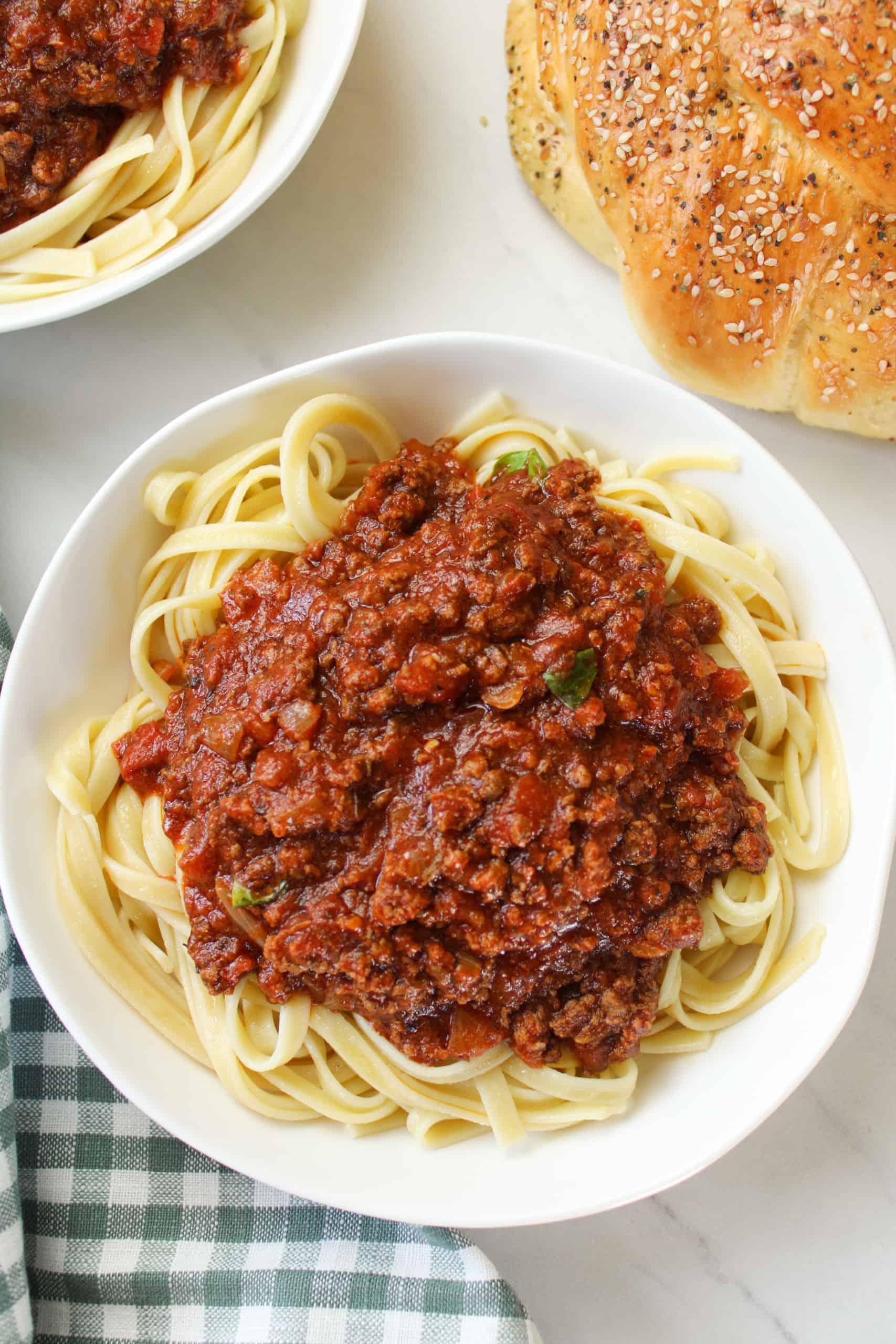 Close up on bison bolognese over pasta.