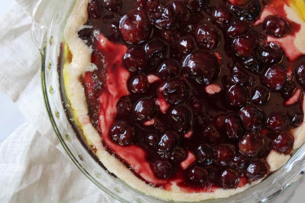 Cherry filling over cobbler topping.