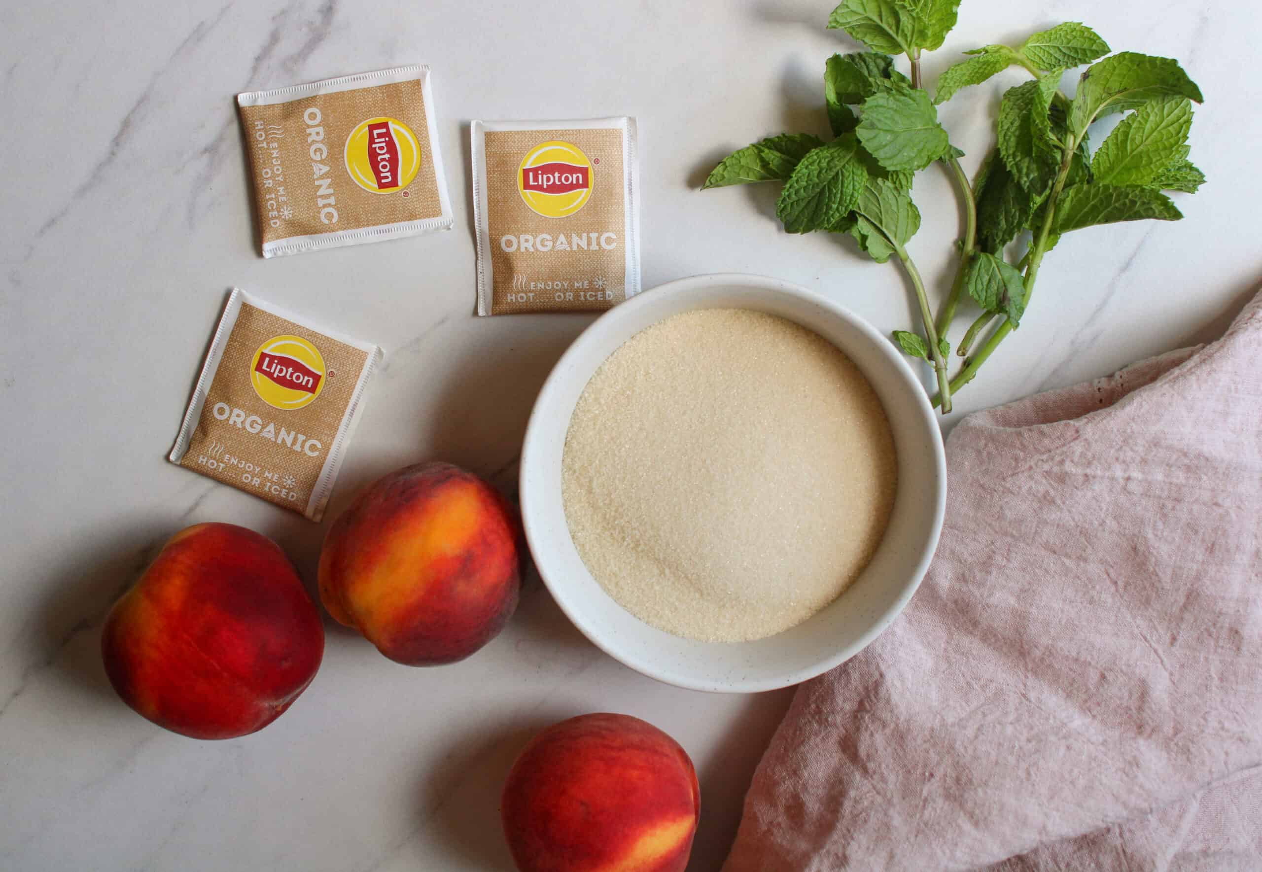 Peach sweet tea ingredients on a table. 