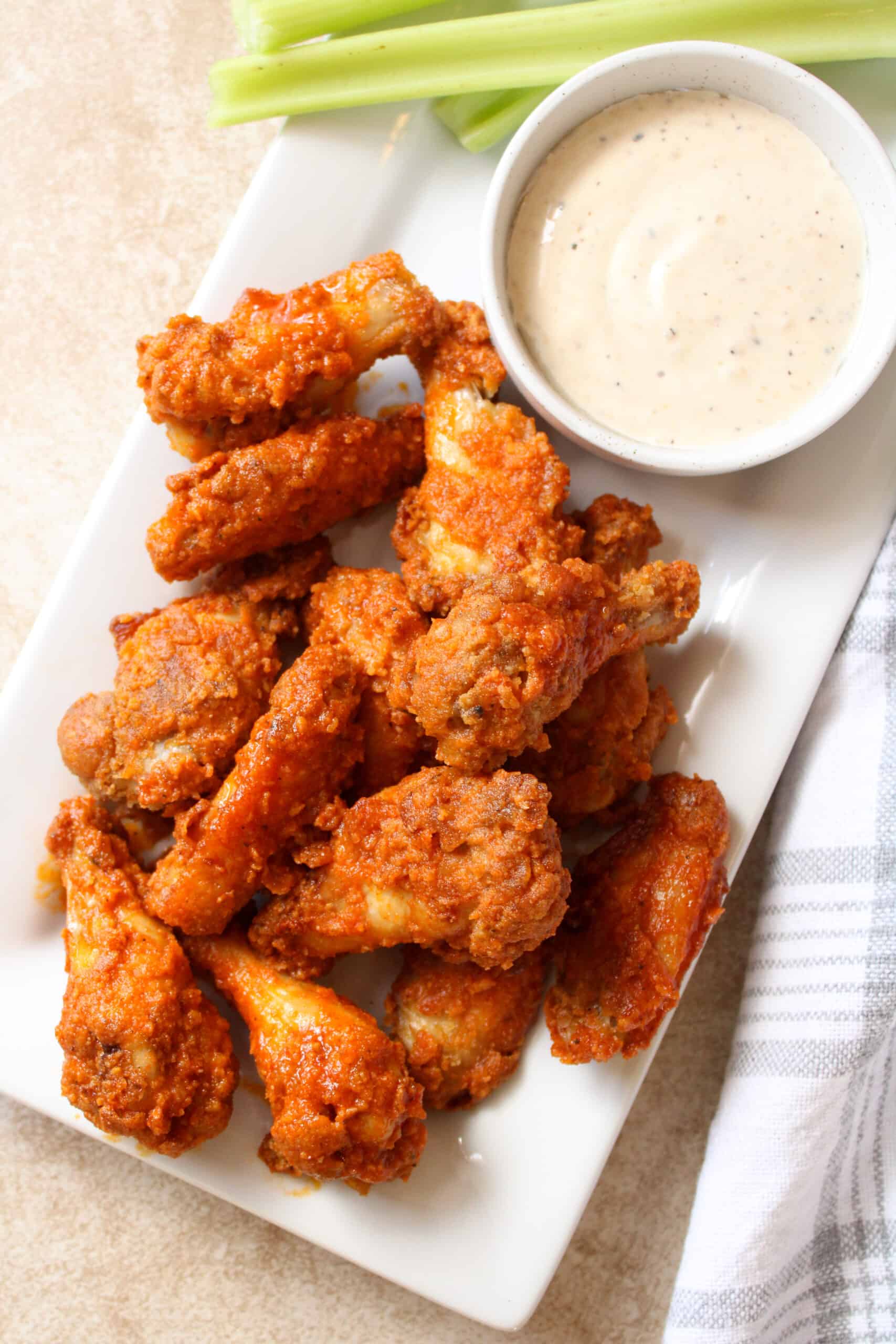 Overhead image of buffalo chicken wings on a platter.