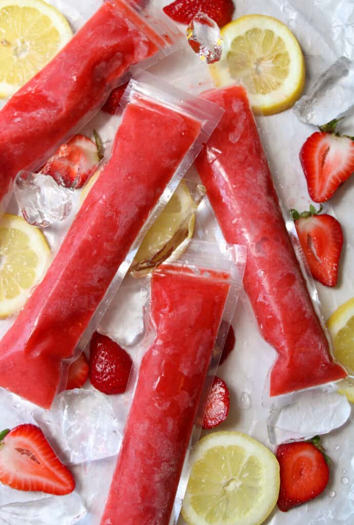 Close up on lemonade popsicles with strawberries. 