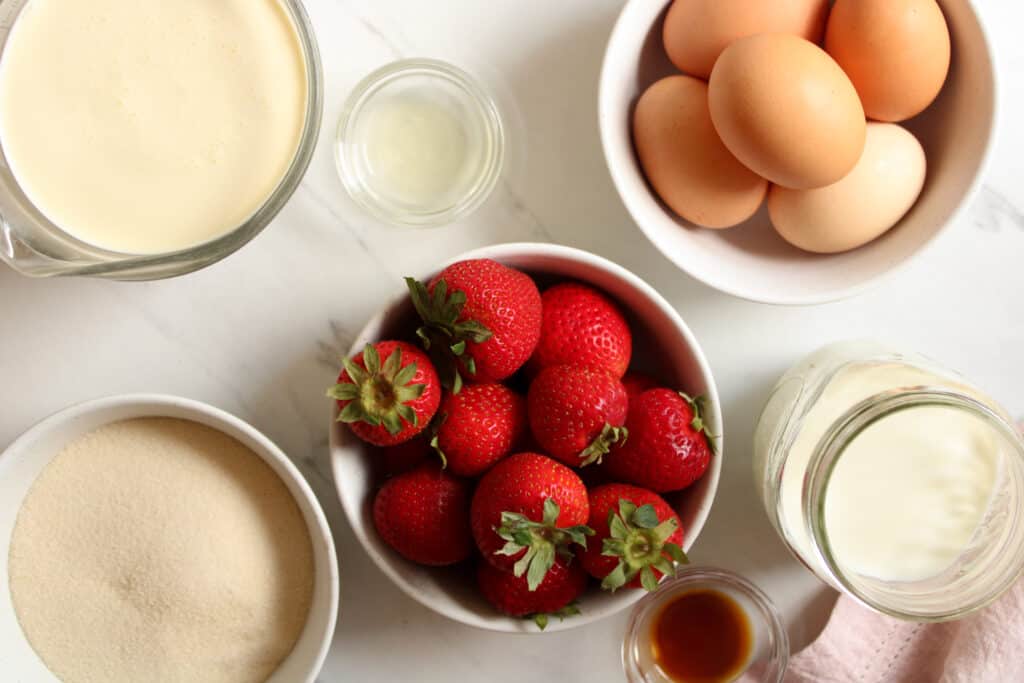 Strawberry ice cream ingredients on a table. 