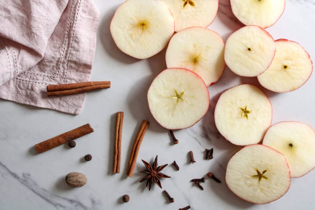 Apple cider stovetop potpourri ingredients on a table. 