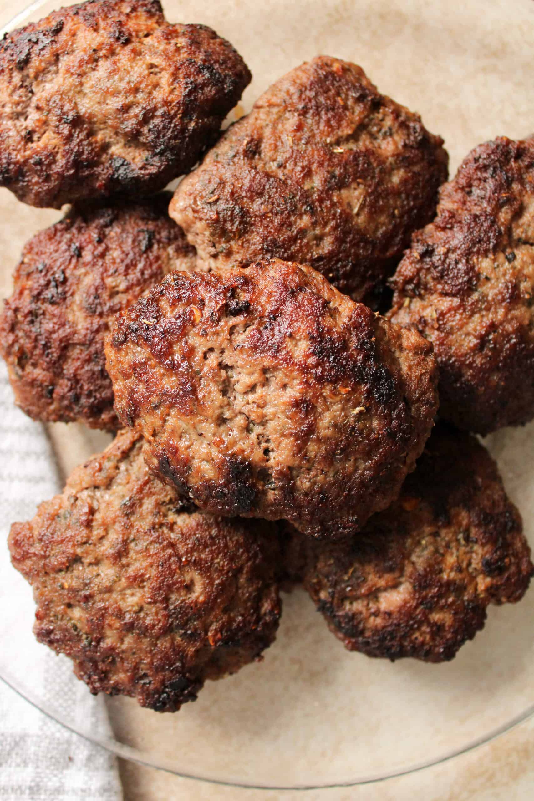 Close up on beef sausage patties.