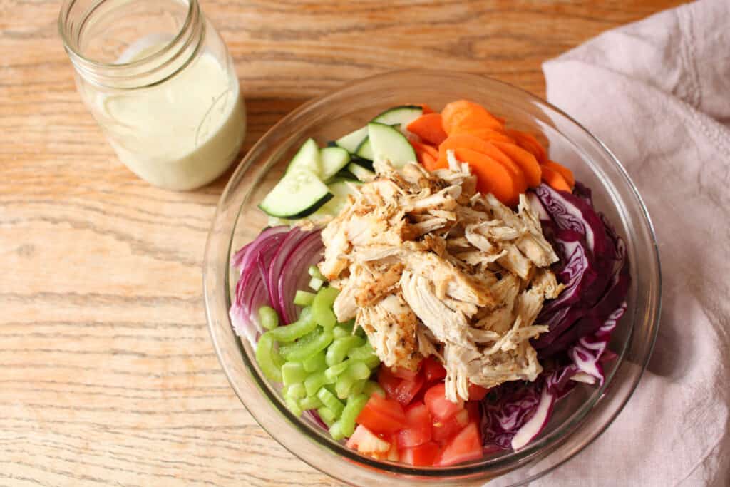 Kale chicken salad with creamy salad dressing. 
