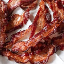 Close up on crispy beef bacon on a paper towel.