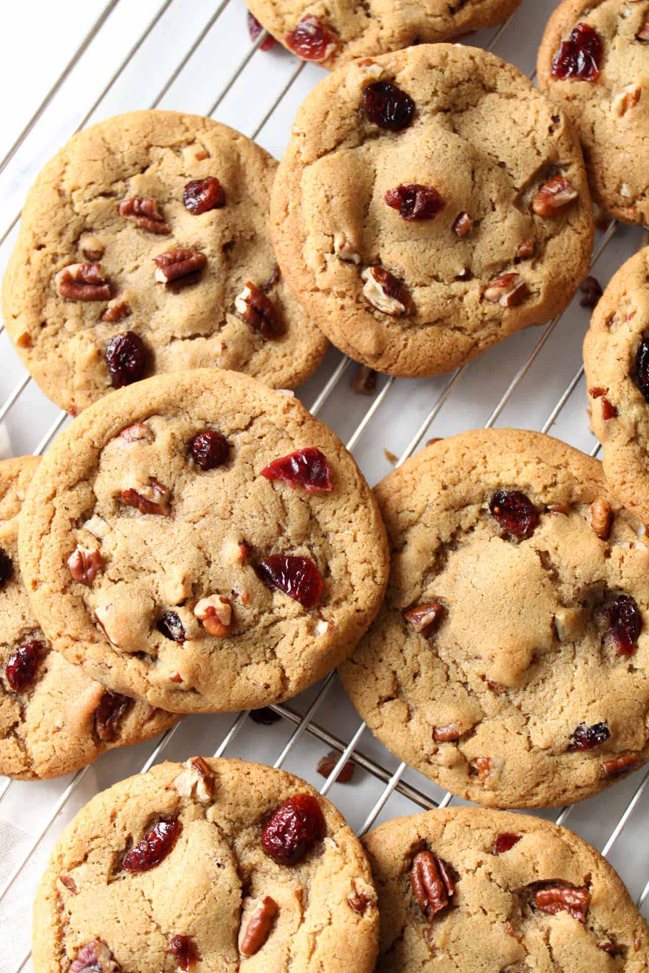 Cranberry pecan cookies on a wire rack.