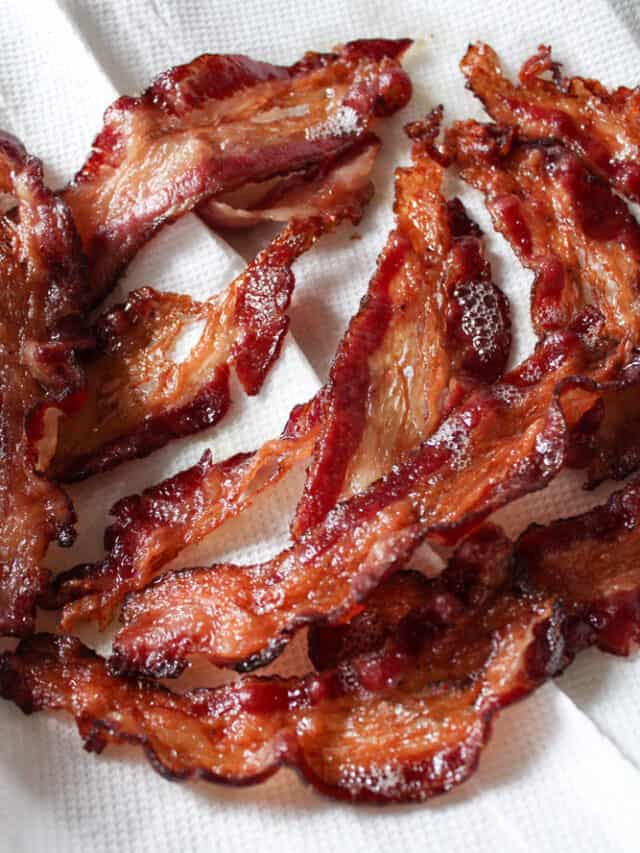 Close up on crispy beef bacon on a paper towel.