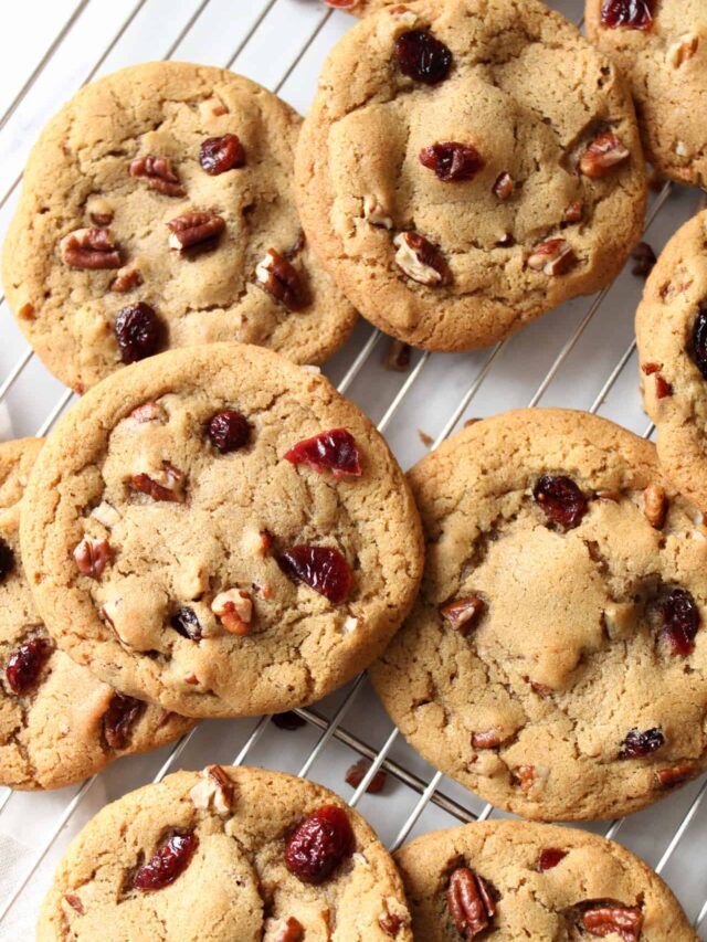 Cranberry pecan cookies on a wire rack.