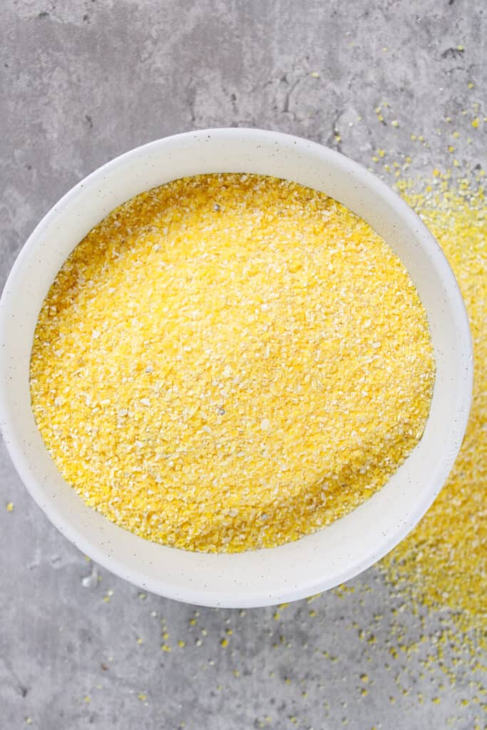 Close up on a bowl of dried polenta(corn grits).