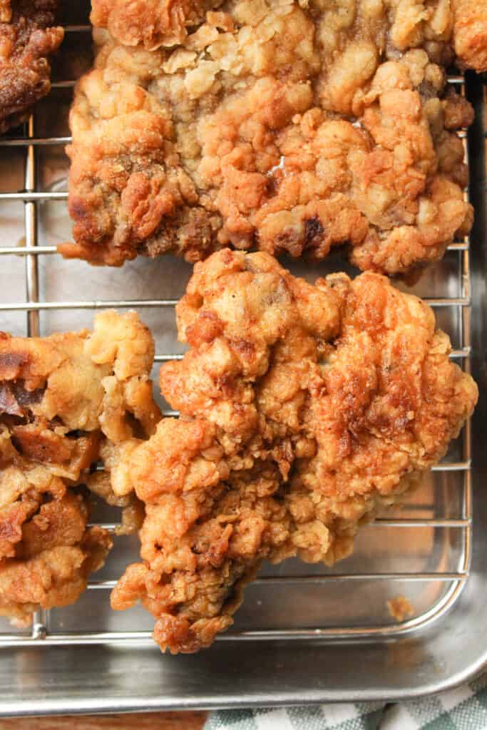 Close up on chicken fried steak on a wire rack. 