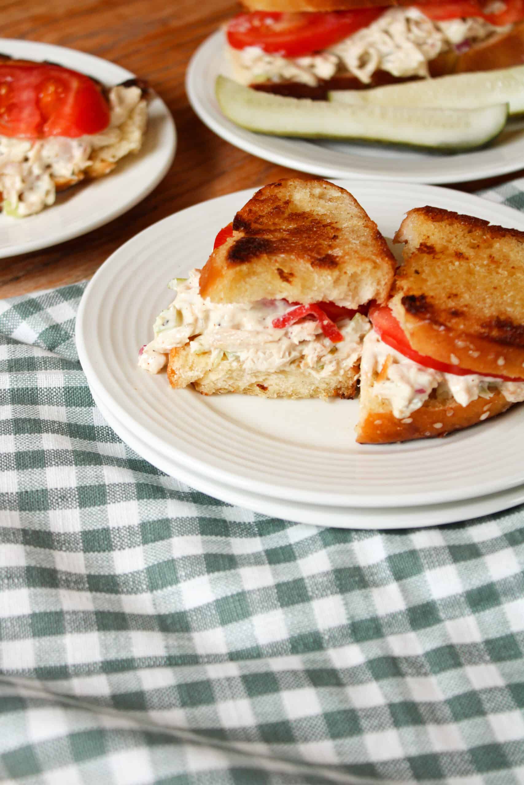 Side view of chicken sandwich on a table.