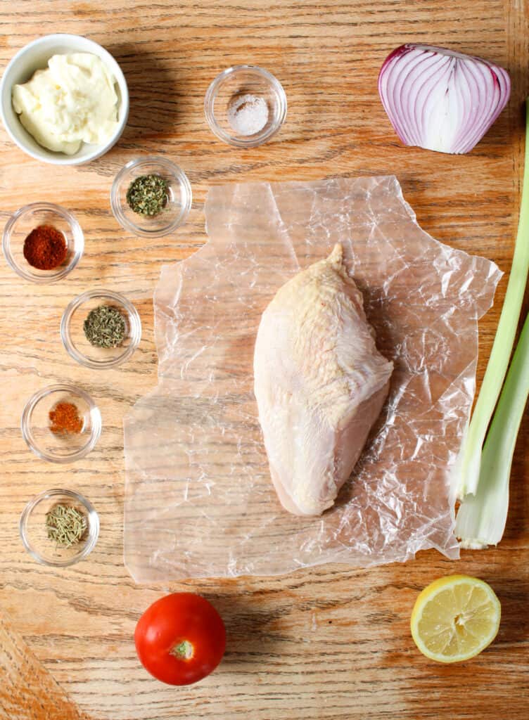 Chicken salad sandwich ingredients on a table.