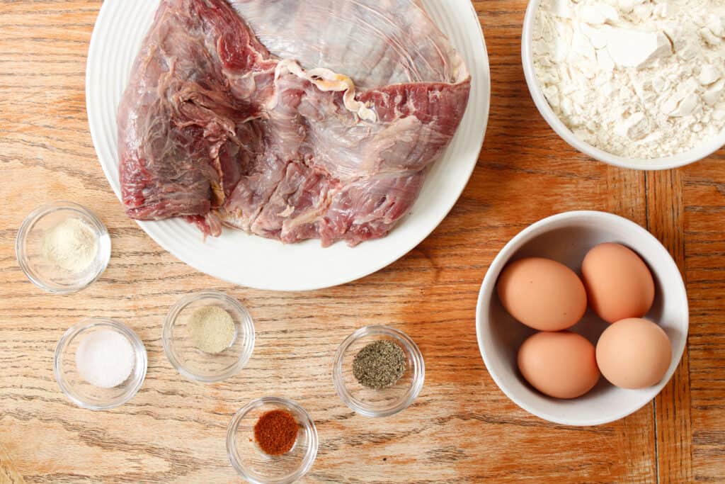 Chicken fried steak ingredients on a table.