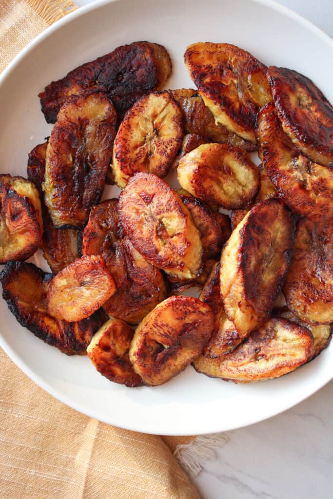 Close up on West African fried plantains on a plate. 