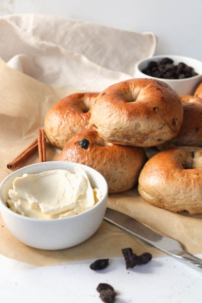 Stacked bagels with cream cheese.